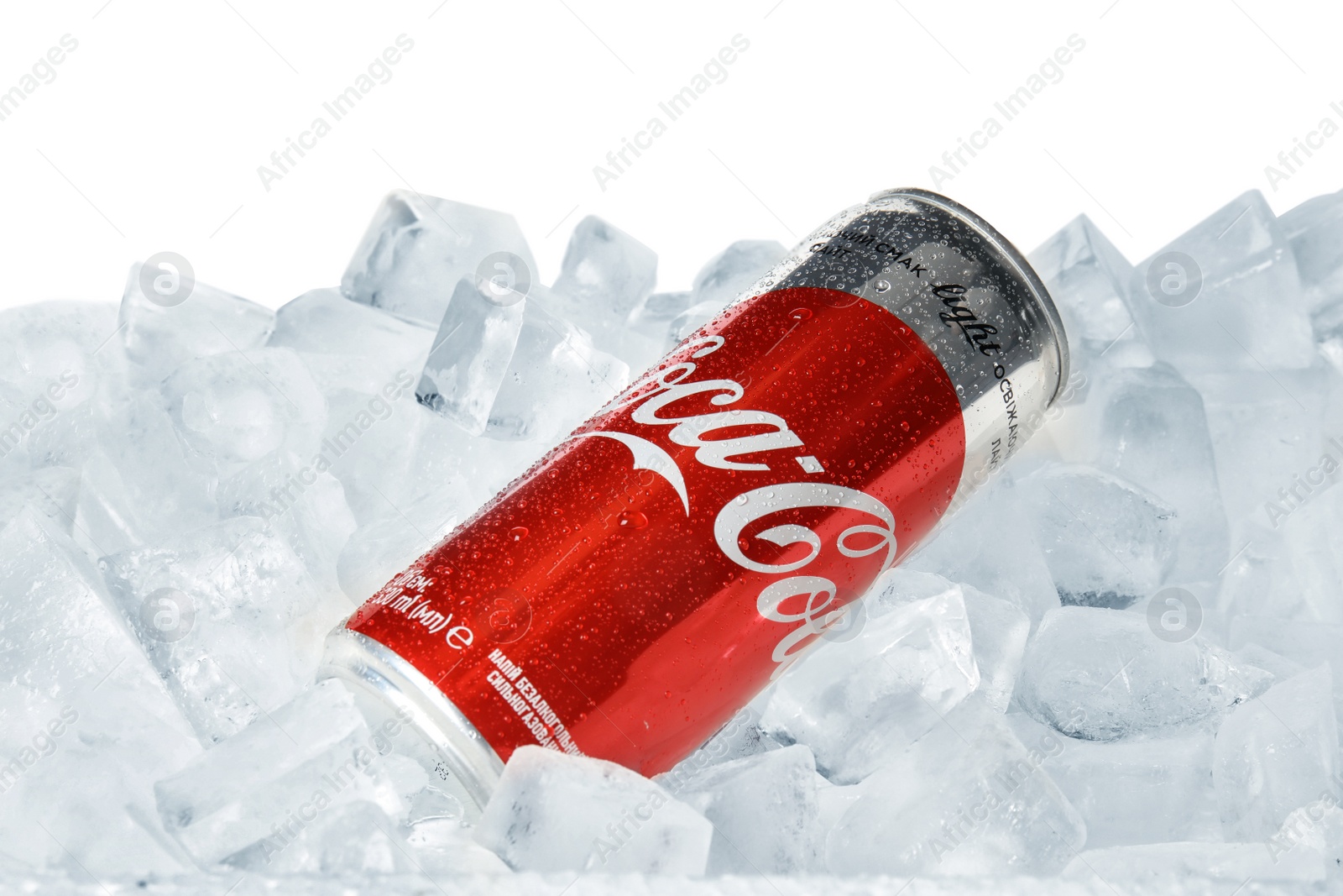 Photo of MYKOLAIV, UKRAINE - NOVEMBER 15, 2018: Coca Cola can on ice cubes against white background