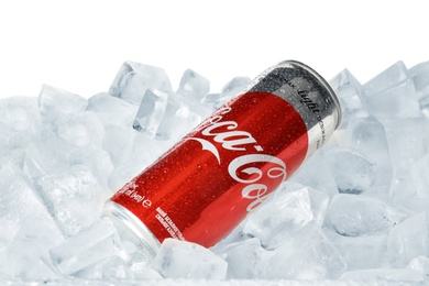 Photo of MYKOLAIV, UKRAINE - NOVEMBER 15, 2018: Coca Cola can on ice cubes against white background