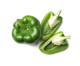 Photo of Whole and cut green bell peppers on white background, top view