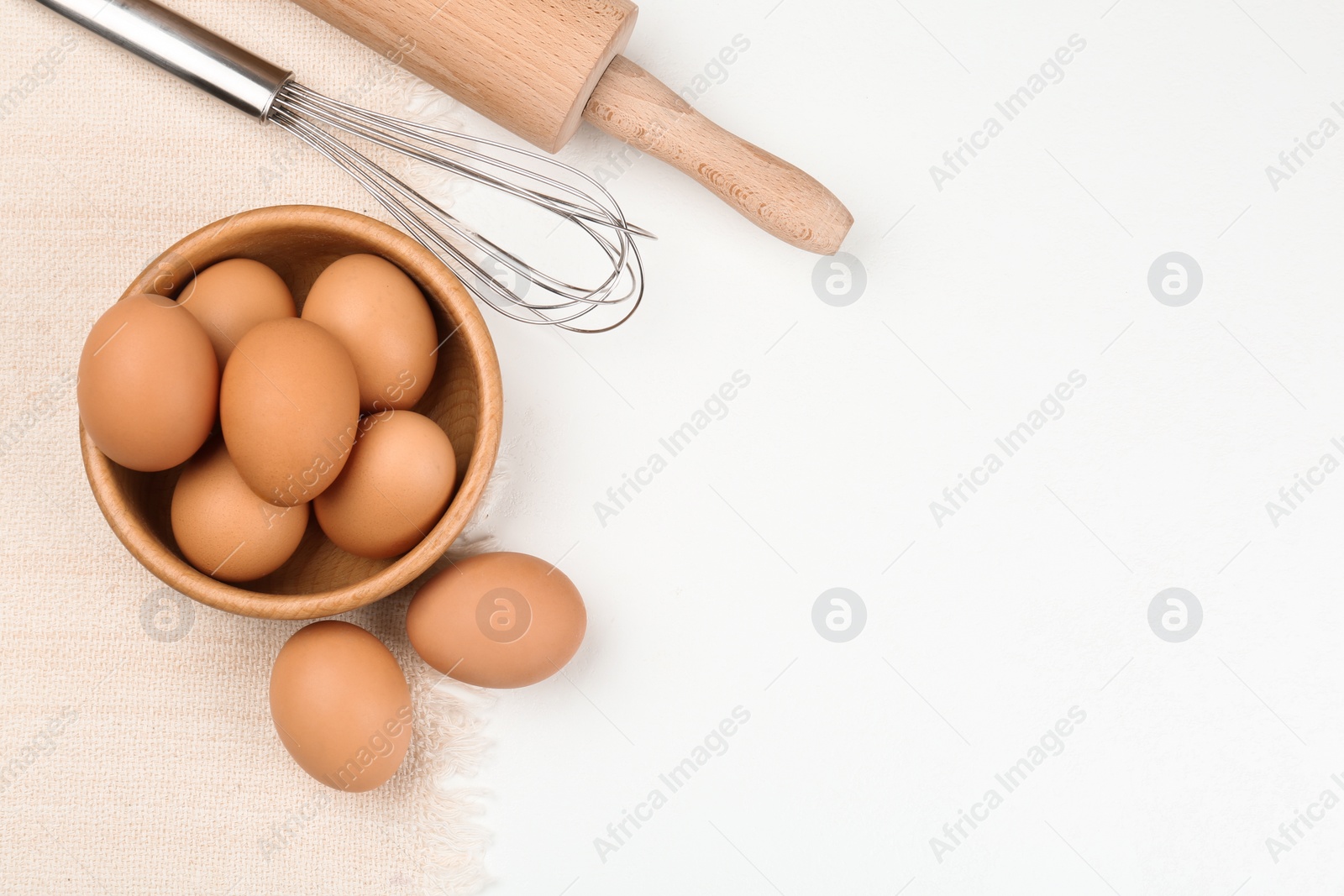 Photo of Flat lay composition with raw eggs on white table, space for text. Baking pie