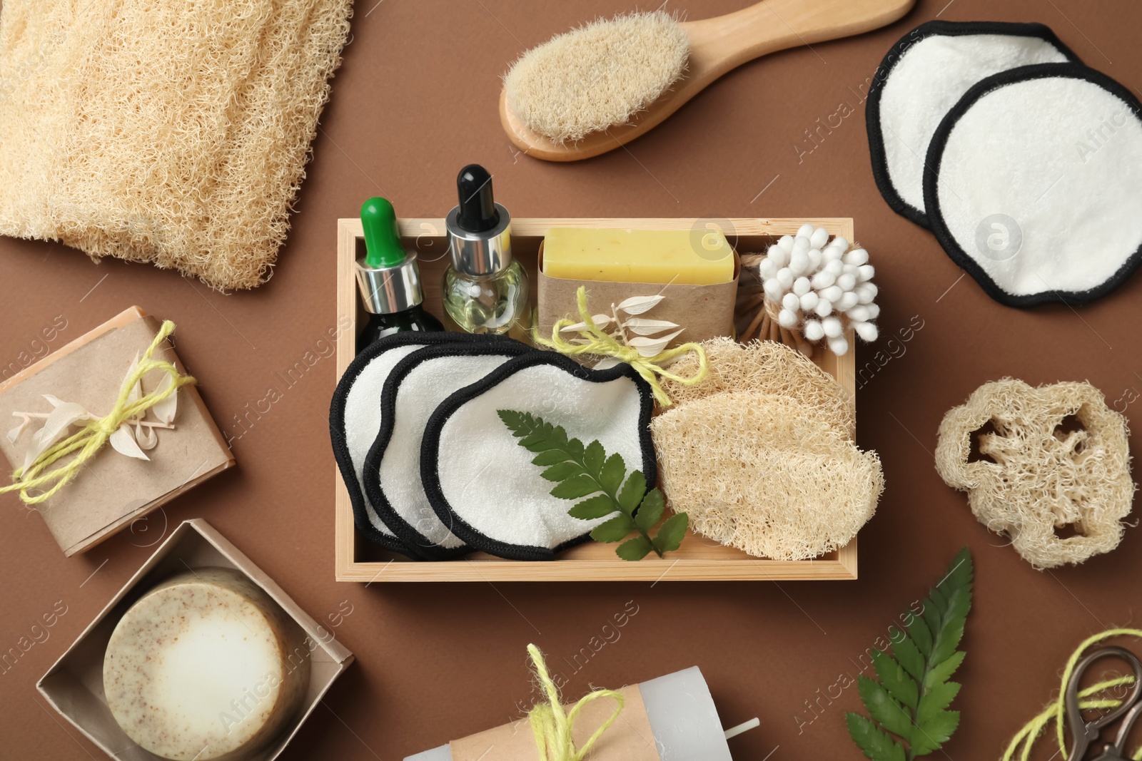 Photo of Flat lay composition with eco friendly products on brown background