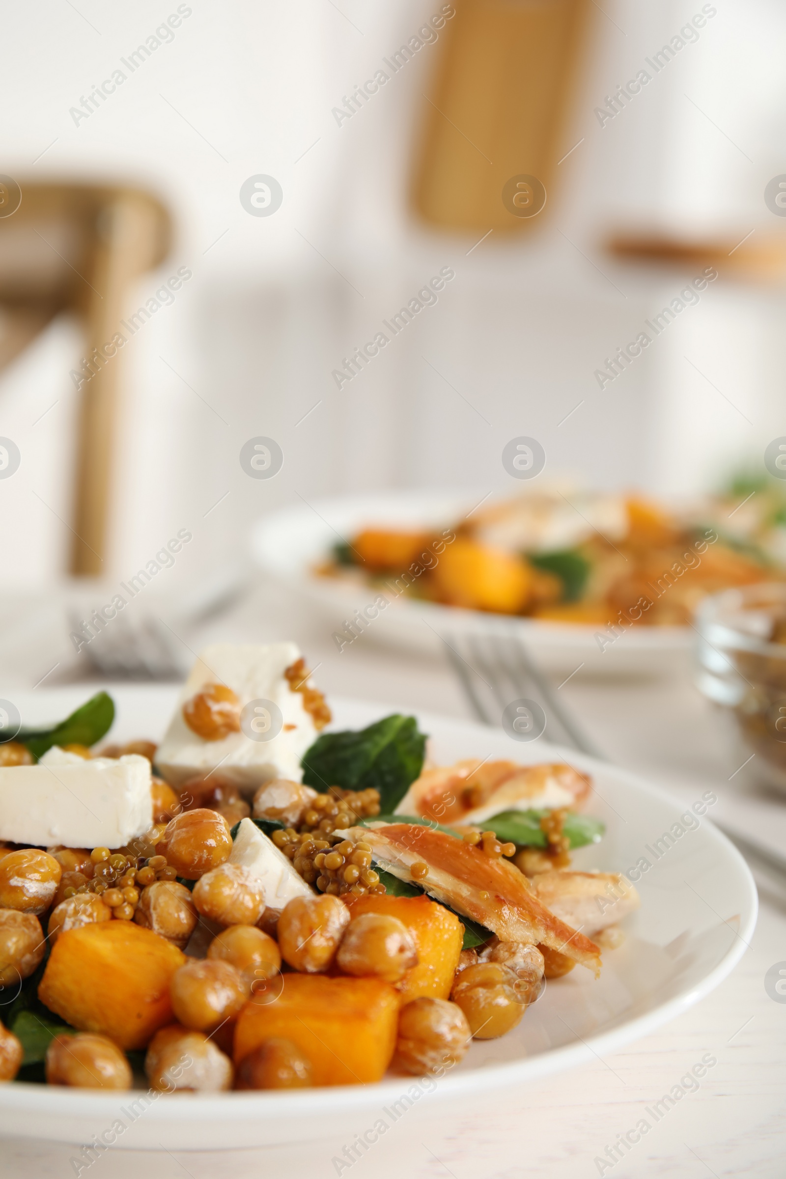 Photo of Delicious fresh chickpea salad on white table