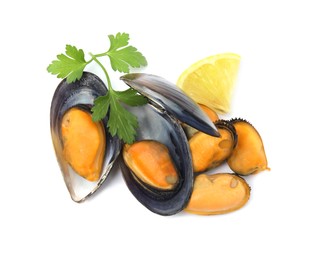 Photo of Delicious cooked mussels with parsley and lemon on white background, top view
