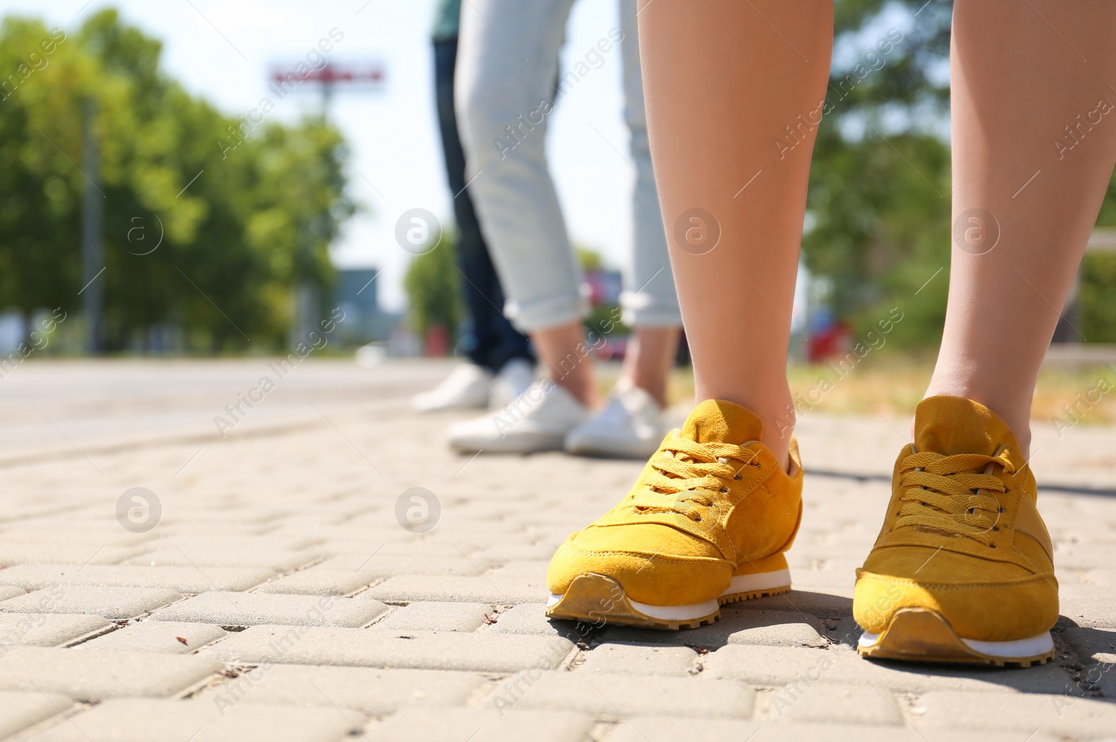 Photo of People keeping social distance in line outdoors, closeup. Coronavirus pandemic