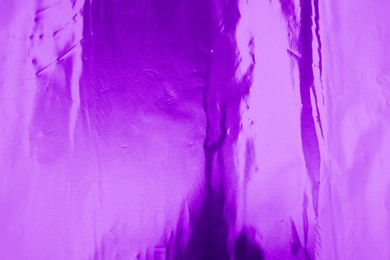 Image of Beautiful purple foil as background, top view