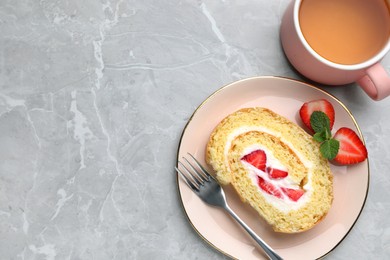 Slice of delicious sponge cake roll with strawberries and cream served on light grey table, flat lay. Space for text