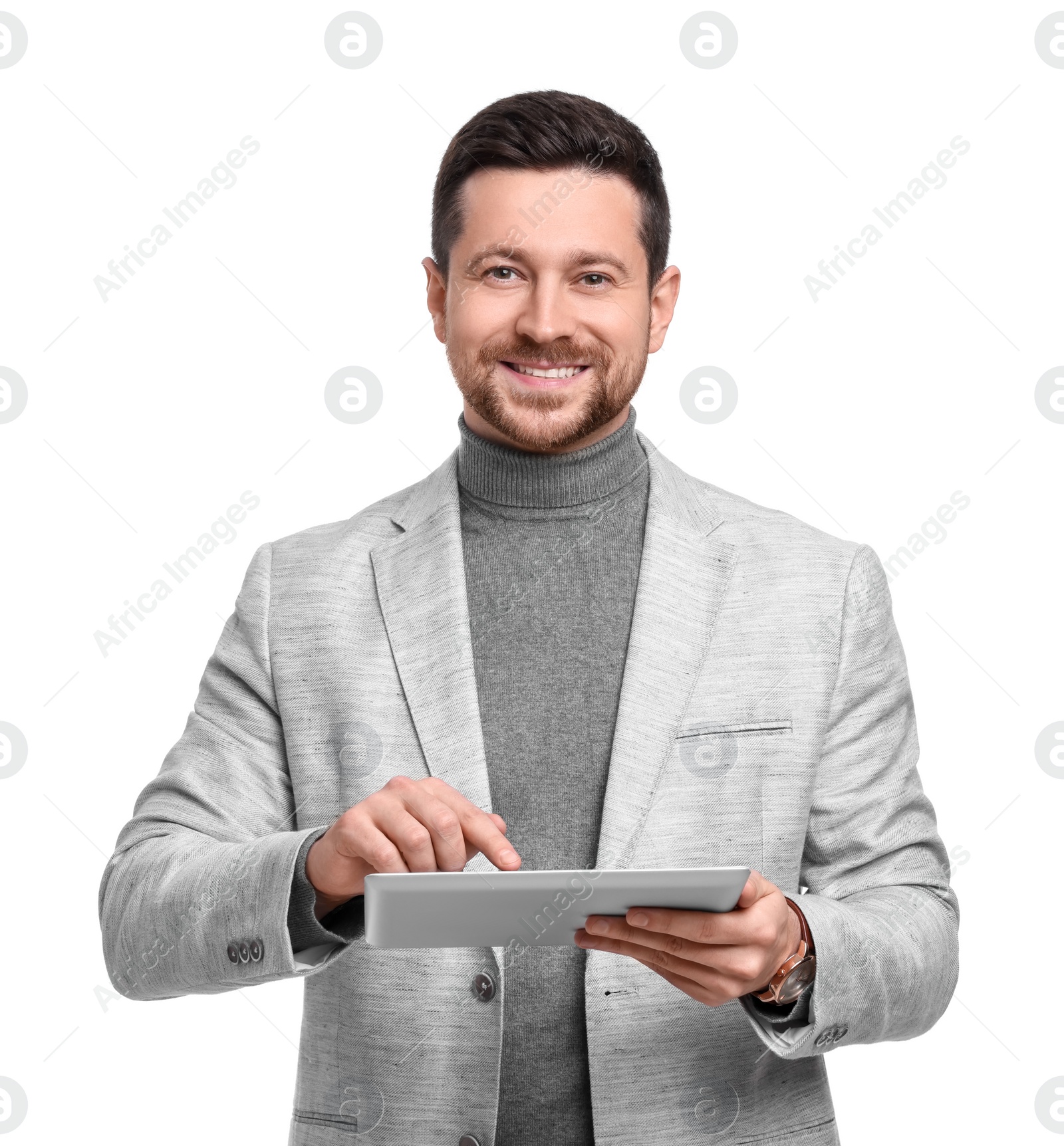 Photo of Handsome bearded businessman using tablet on white background