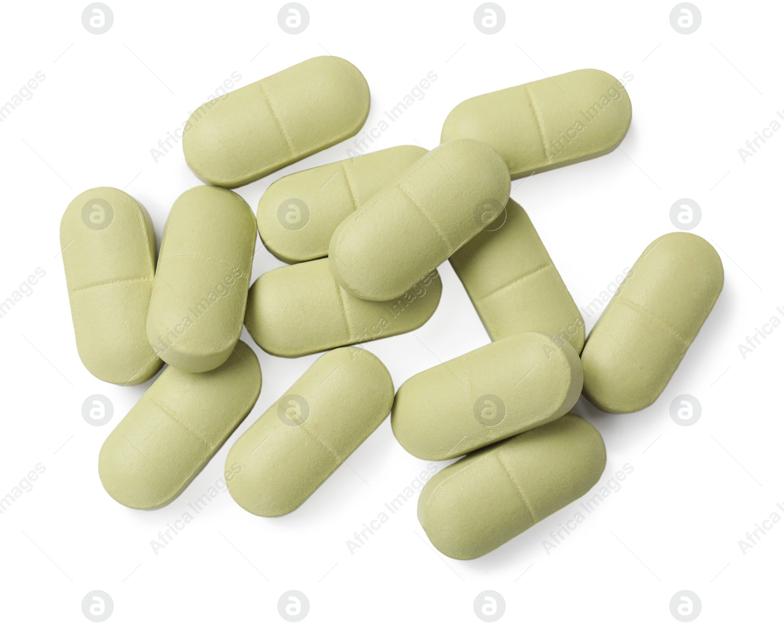 Photo of Light green vitamin pills isolated on white, top view