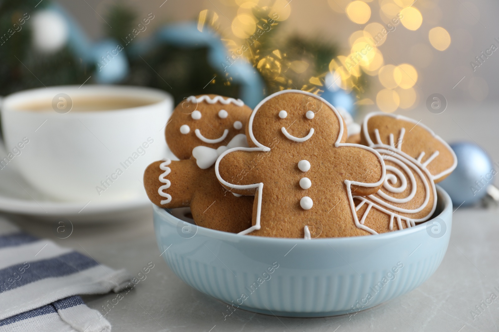 Photo of Delicious Christmas cookies in bowl on light table