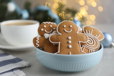 Delicious Christmas cookies in bowl on light table