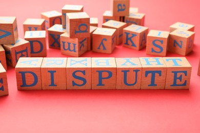 Photo of Cubes with word Dispute on color background