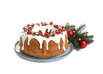 Traditional Christmas cake and decorations on white background
