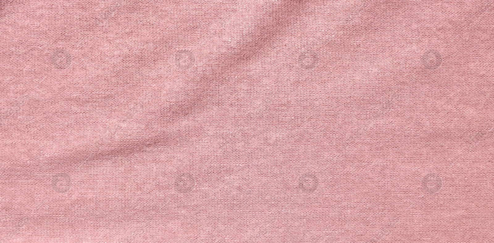 Photo of Texture of soft pink fabric as background, top view