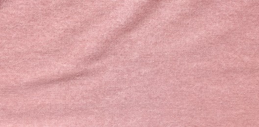 Texture of soft pink fabric as background, top view