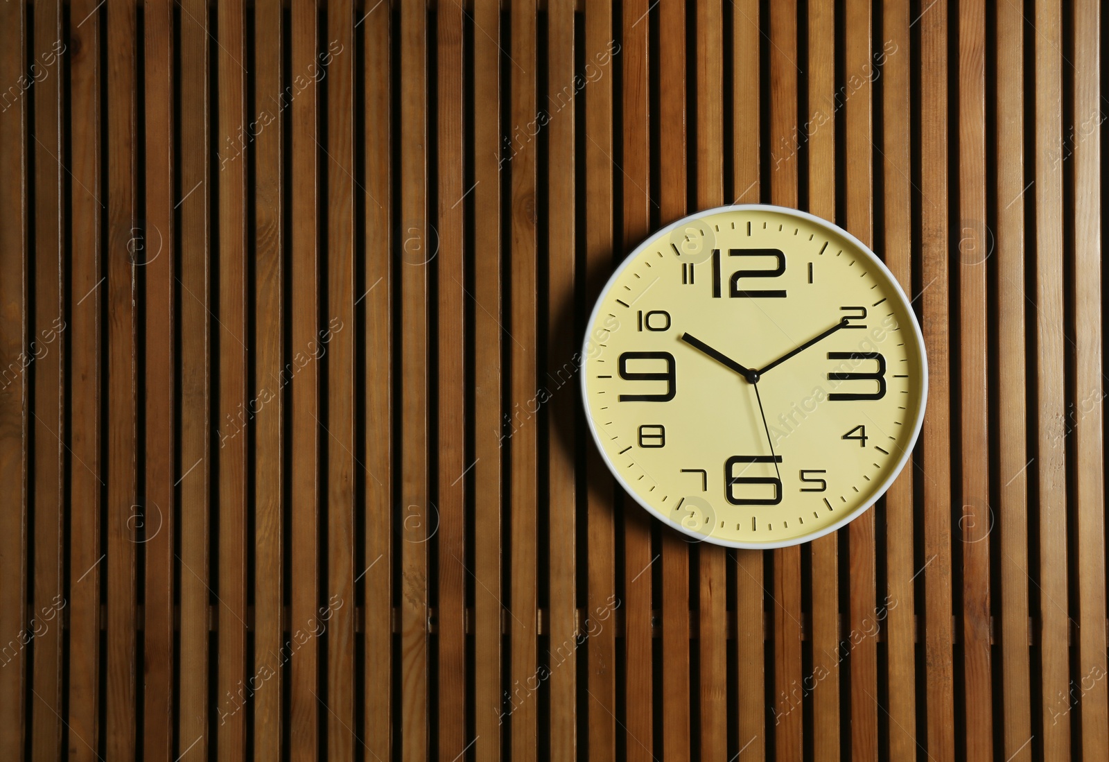 Photo of Stylish clock and space for text on wooden background. Time management