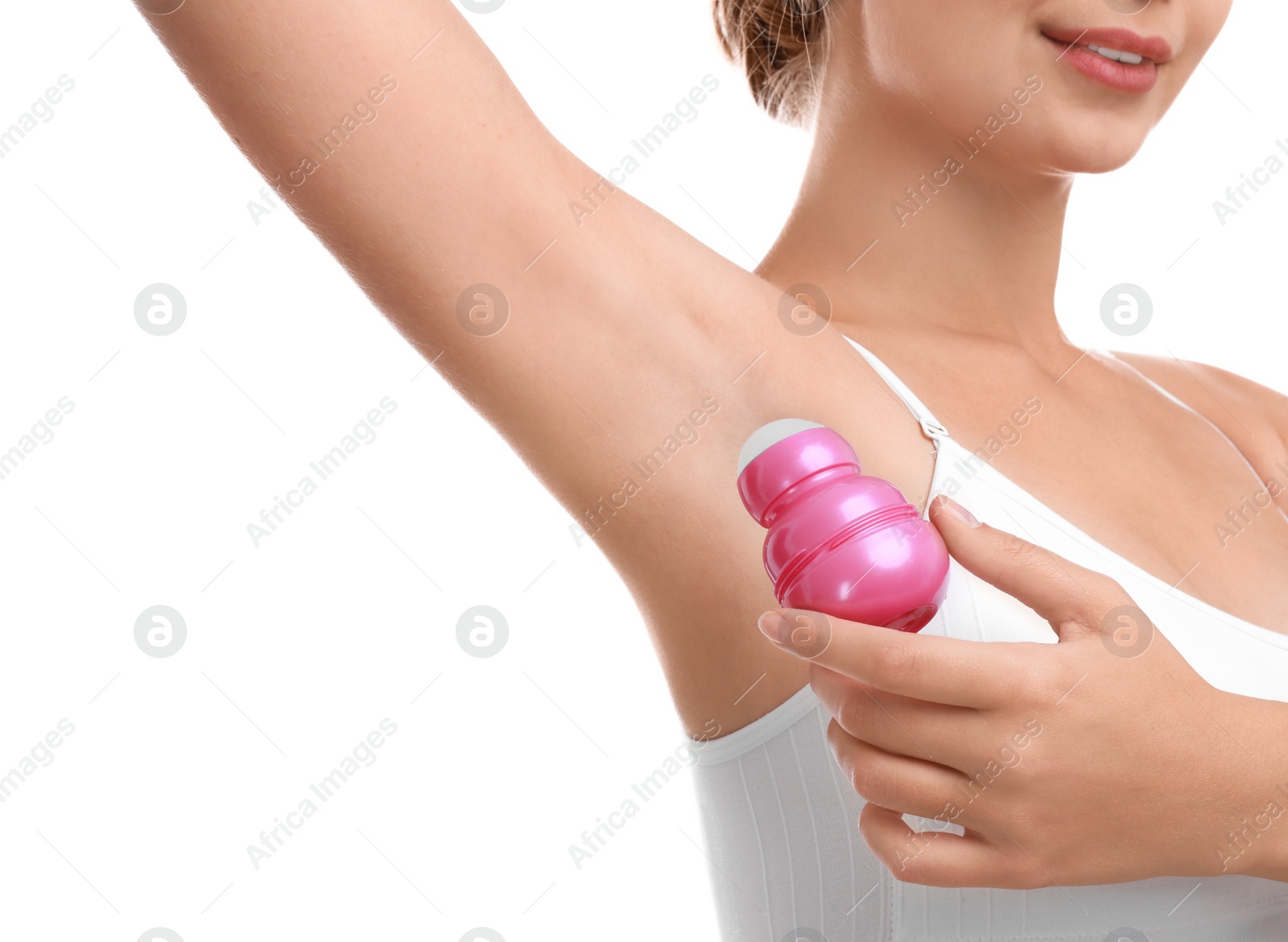 Photo of Young woman applying deodorant to armpit on white background, closeup