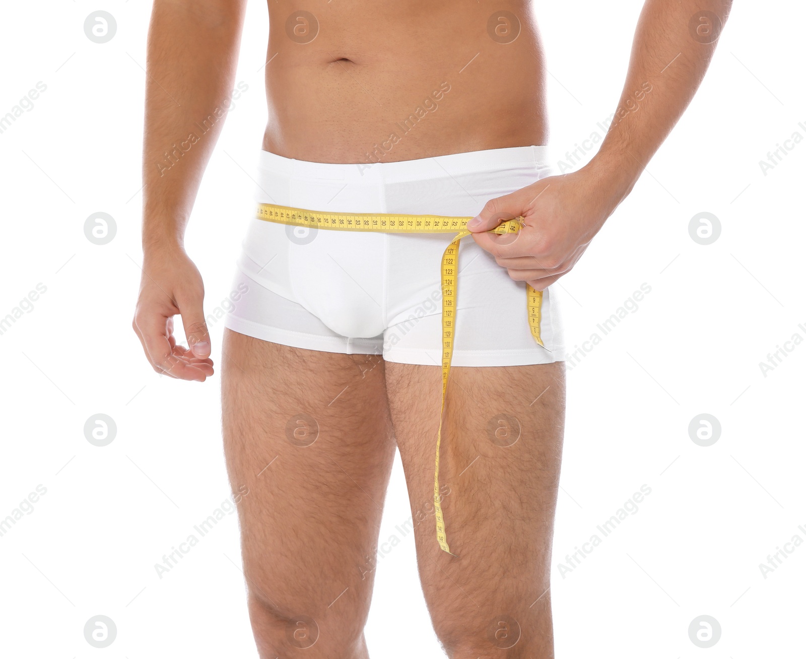 Photo of Fit man measuring his hips on white background, closeup. Weight loss