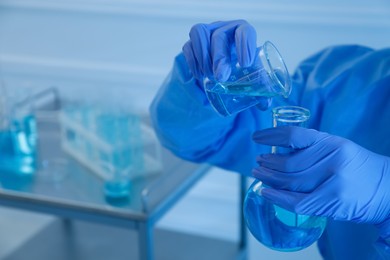 Photo of Scientist working with sample in laboratory, closeup. Medical research