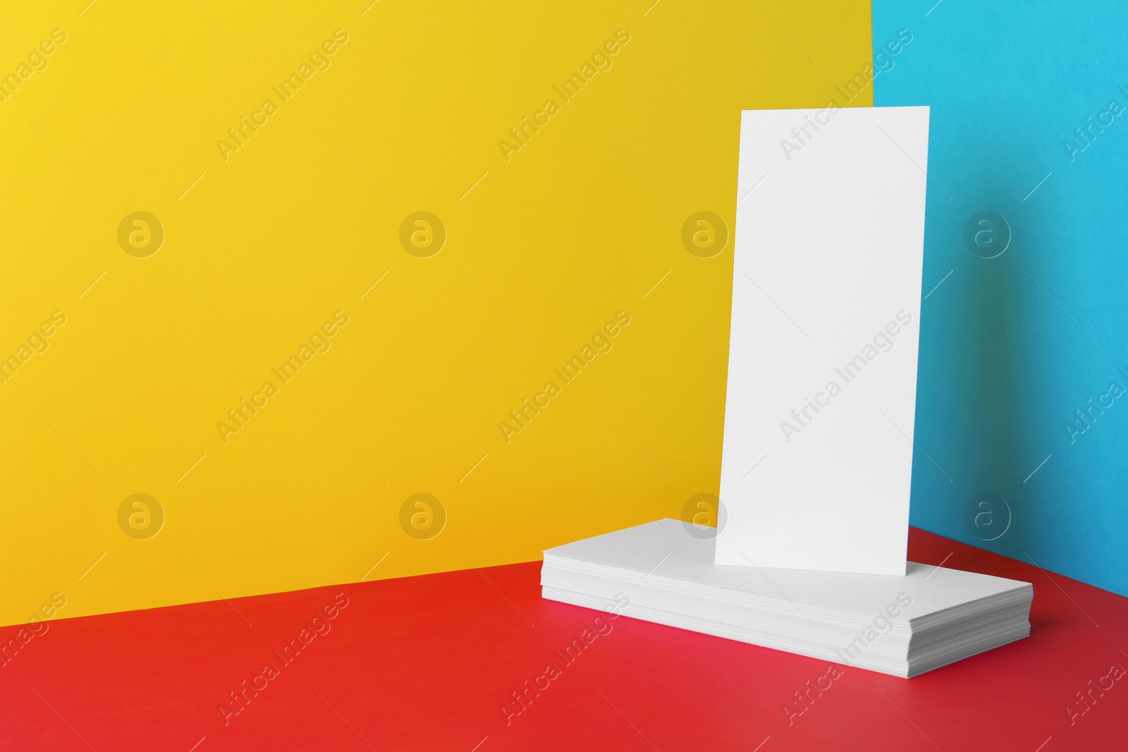 Photo of Empty sheets on color background. Mockup for design