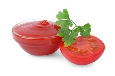 Photo of Organic ketchup in bowl, fresh tomato and parsley isolated on white. Tomato sauce