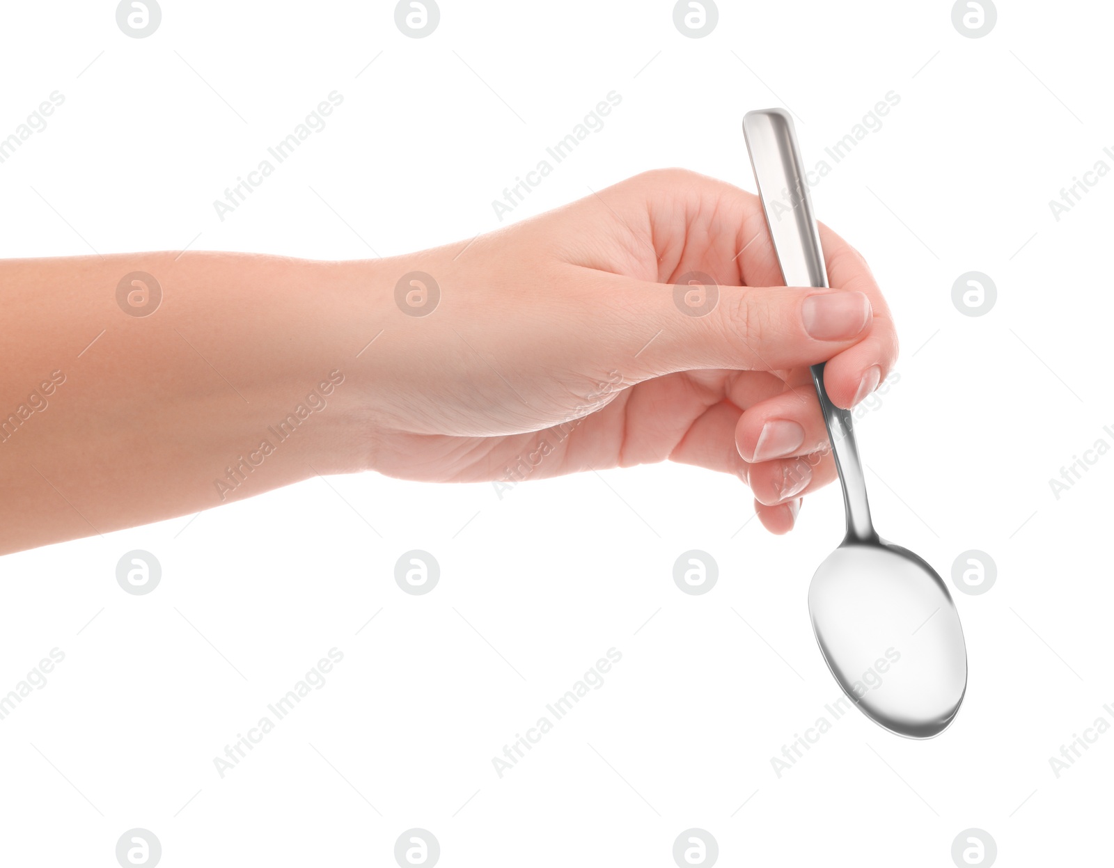 Photo of Woman holding new shiny spoon on white background, closeup