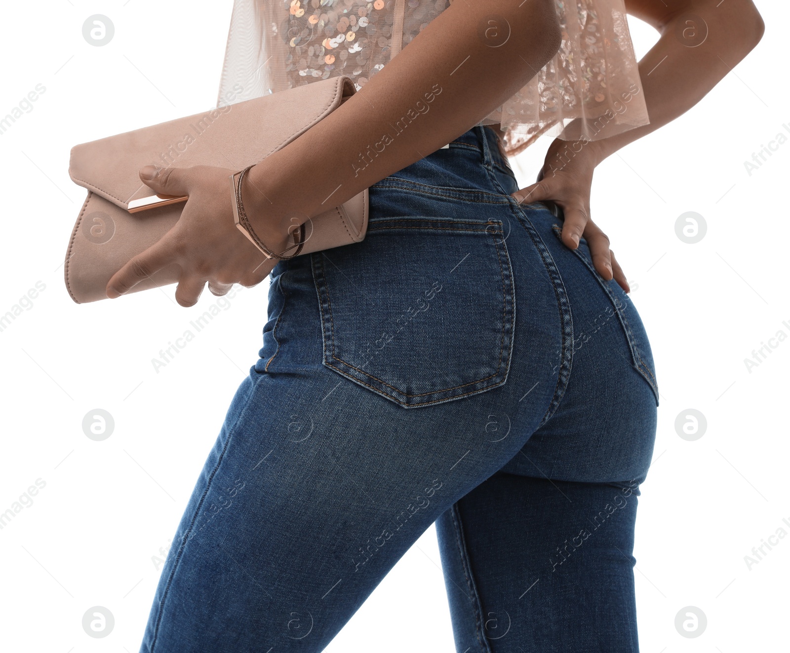 Photo of Woman in jeans with clutch purse on white background, closeup