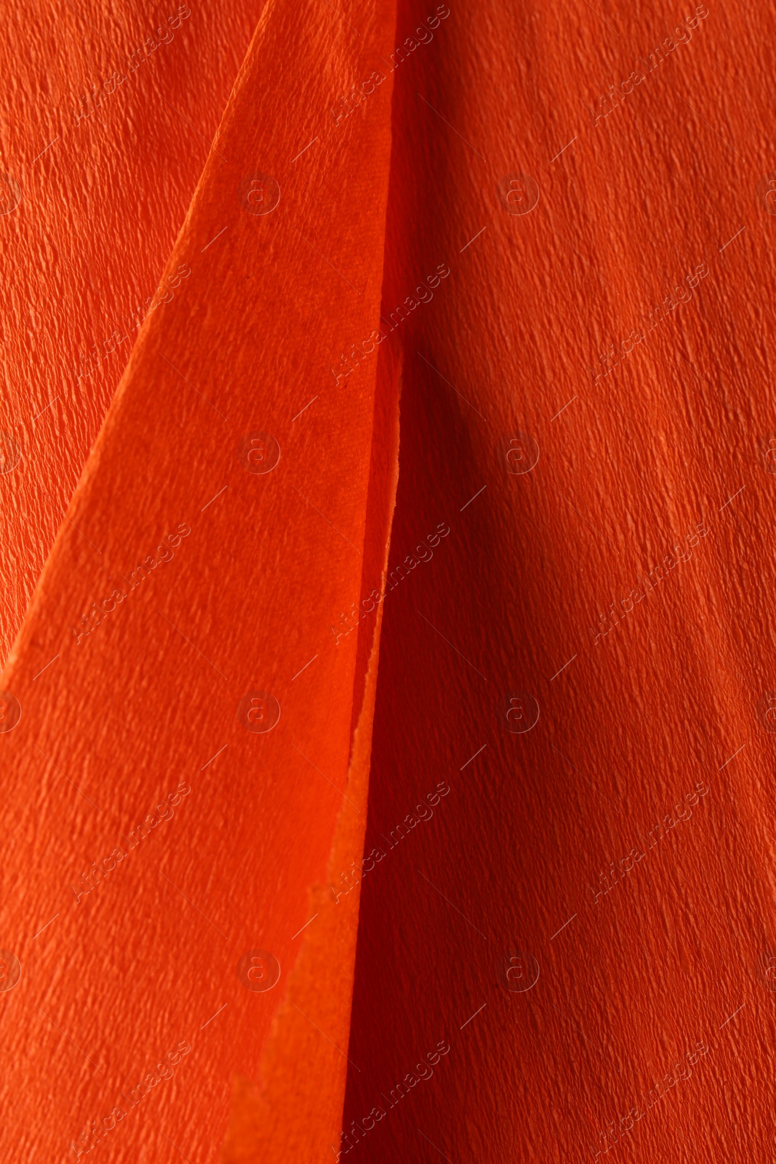 Photo of Orange textured material as background, closeup view