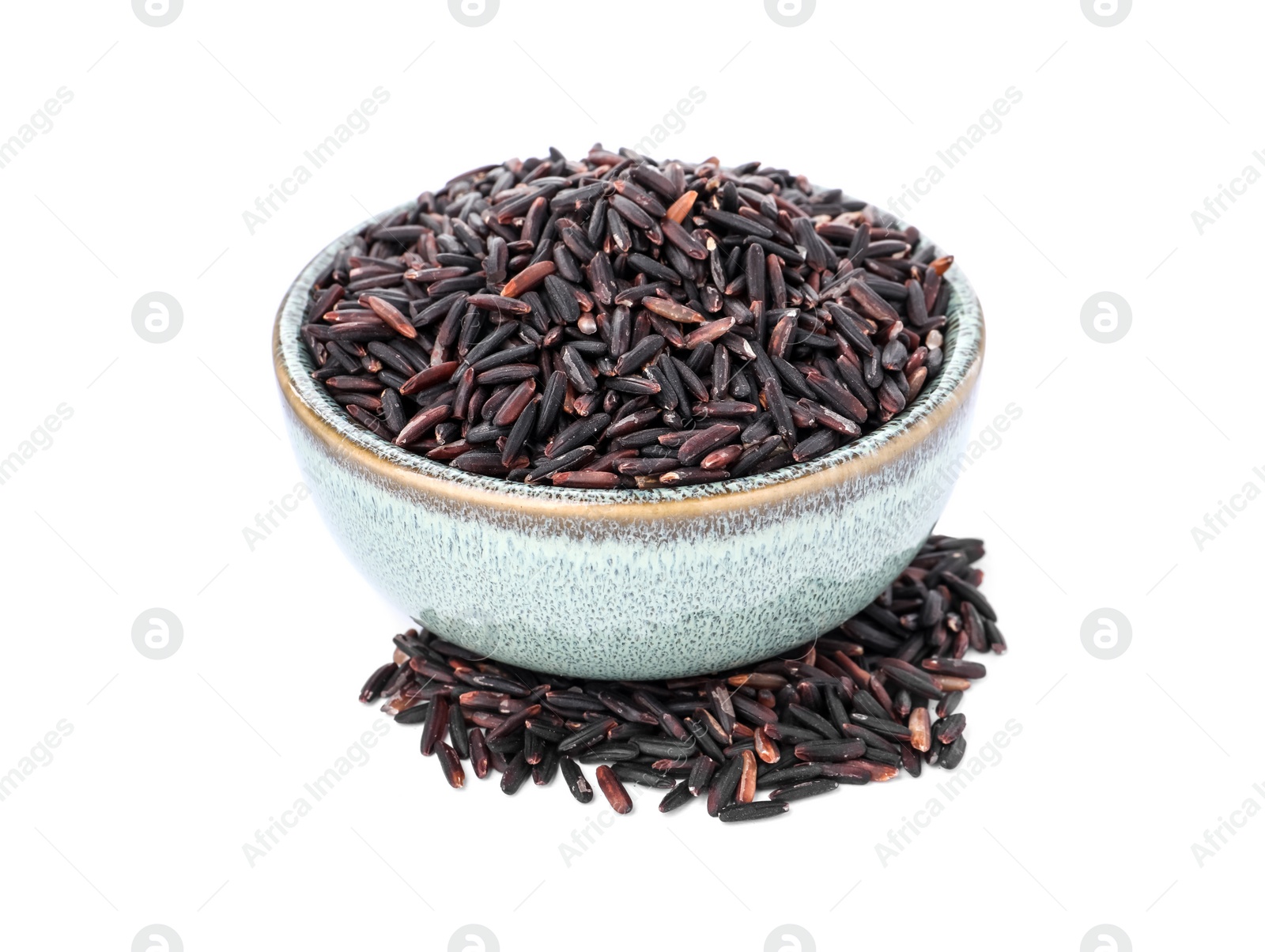 Photo of Bowl with raw black rice isolated on white