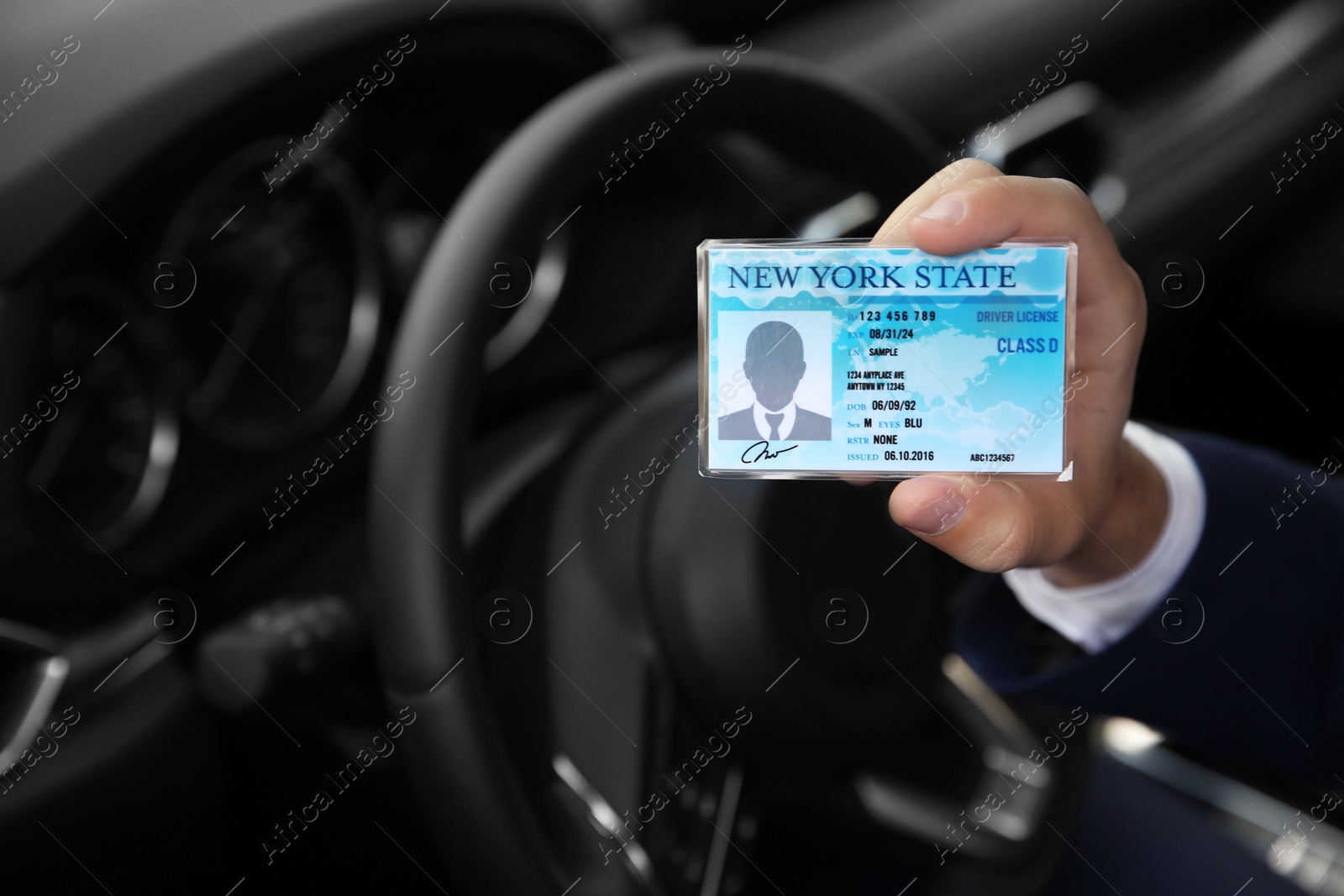 Photo of Man holding driving license in car, closeup. Space for text