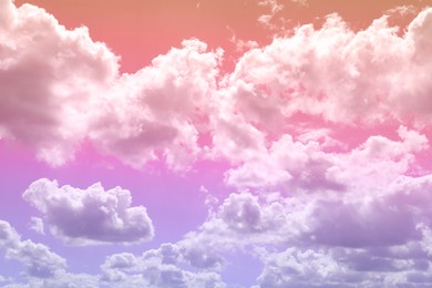 Image of Magic sky with fluffy clouds toned in bright colors