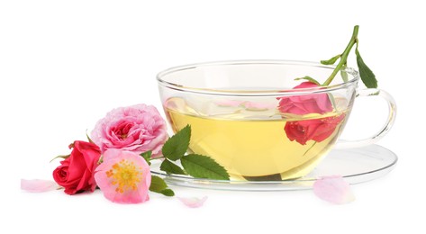 Photo of Aromatic herbal tea in glass cup and flowers isolated on white