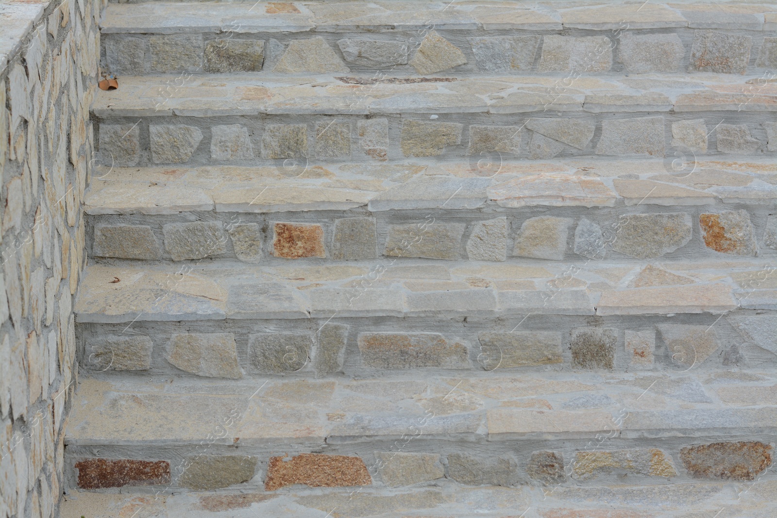 Photo of View of empty concrete staircase with stone fragments outdoors