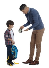 Teacher with alarm clock scolding pupil for being late against white background