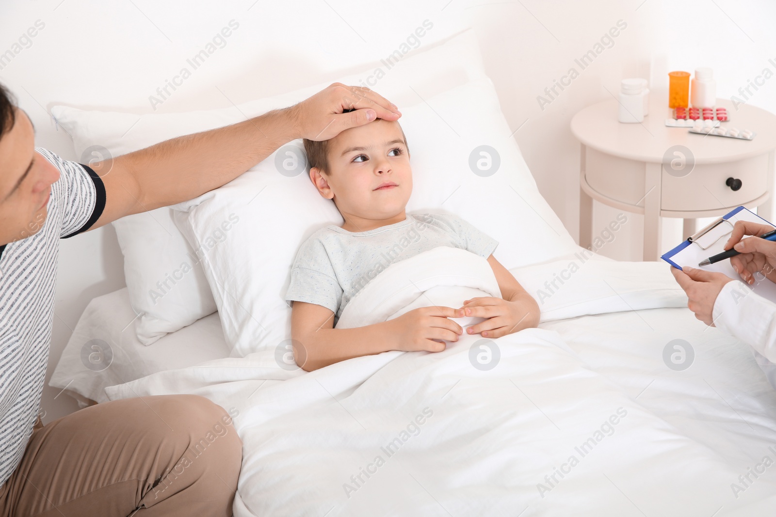 Photo of Children's doctor visiting little patient at home