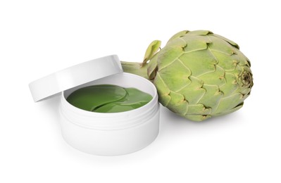 Photo of Package of under eye patches and artichoke on white background. Cosmetic product