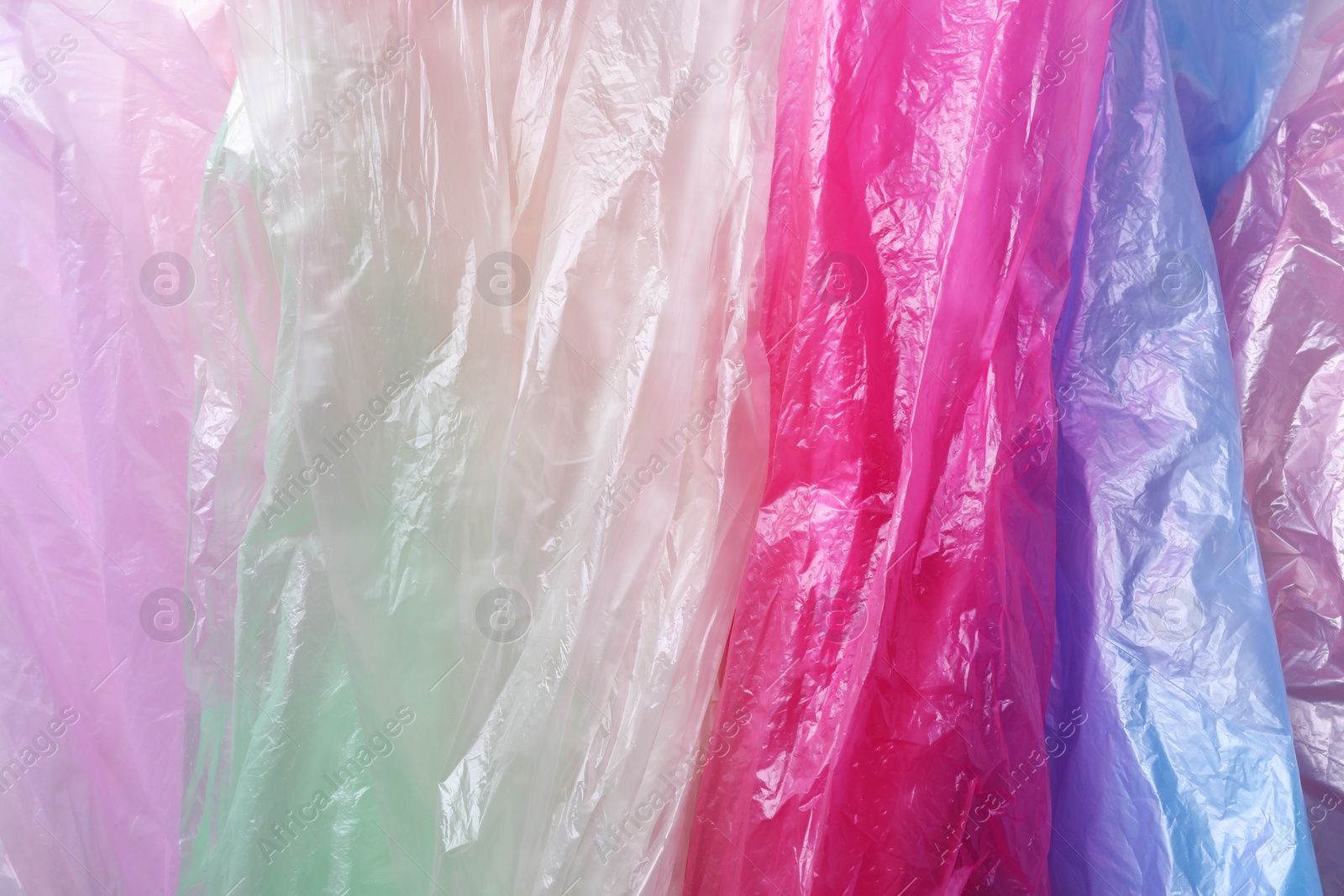 Photo of Many plastic bags as background, top view