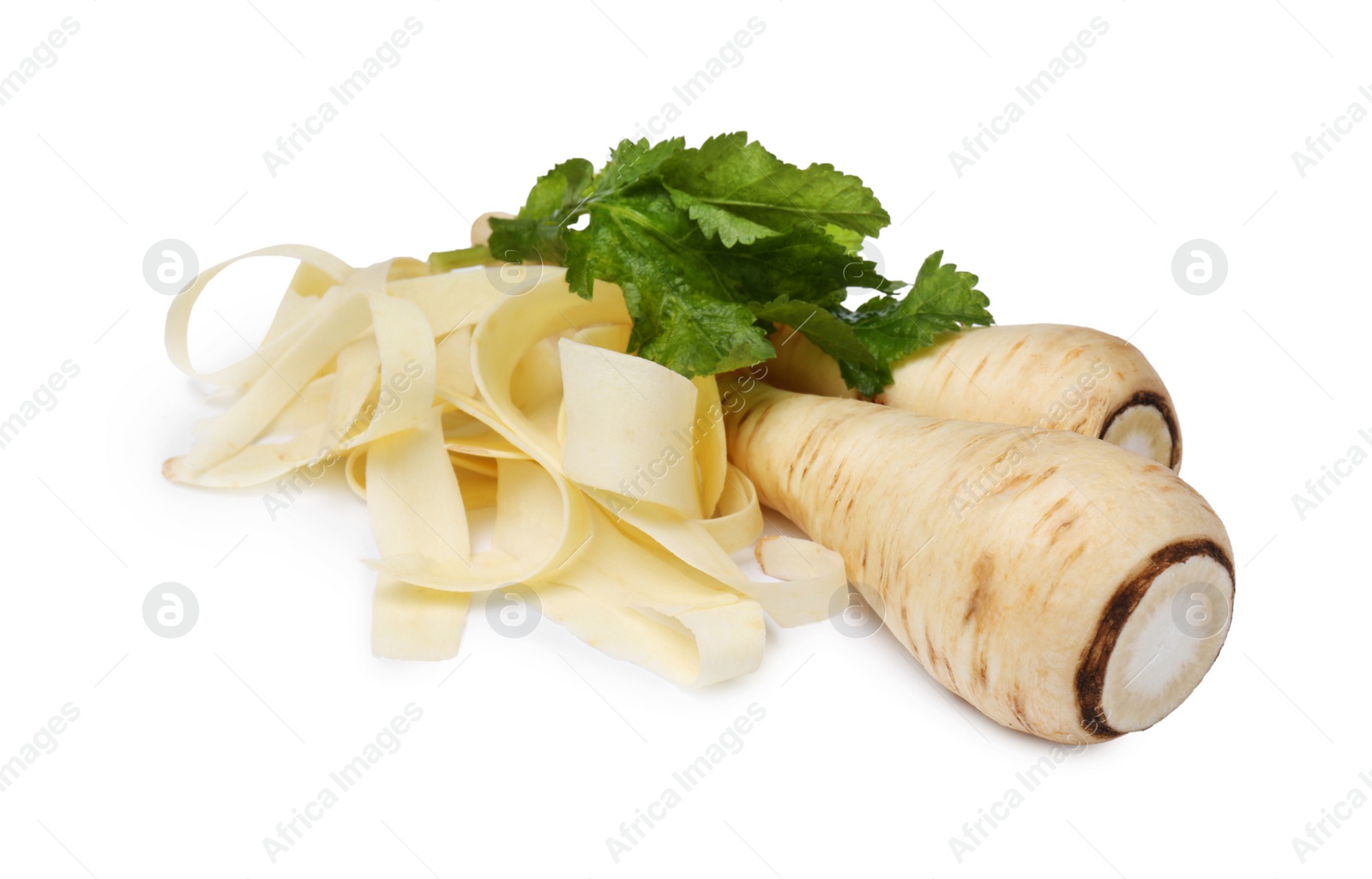 Photo of Whole and sliced fresh ripe parsnip with leaves on white background, closeup