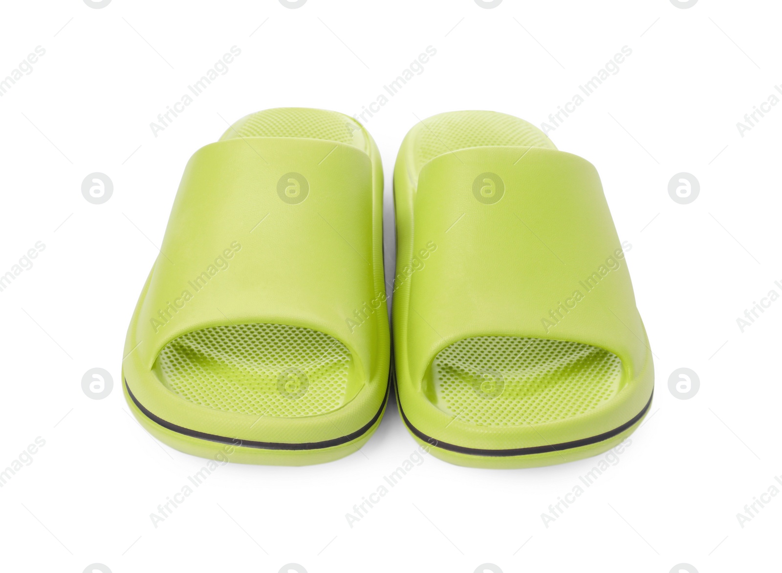 Photo of Pair of green rubber slippers isolated on white