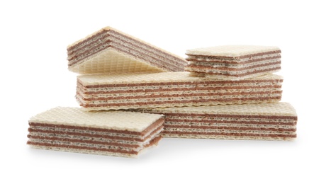 Photo of Delicious wafer sticks with chocolate filling isolated on white