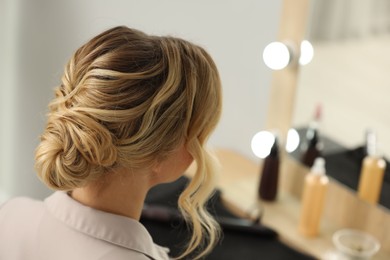 Photo of Woman with beautiful hair style in salon. Space for text