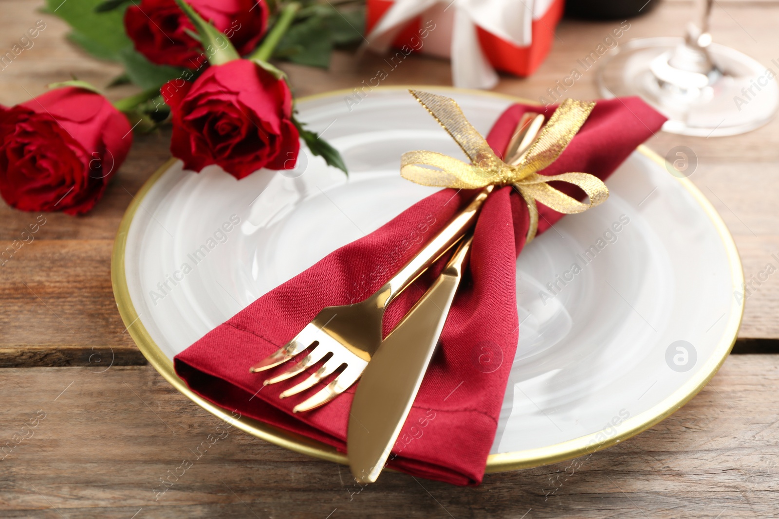 Photo of Beautiful table setting for Valentine's Day dinner on wooden background, closeup