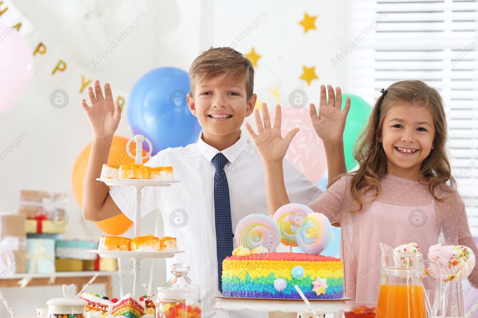 Photo of Happy children at birthday party in decorated room