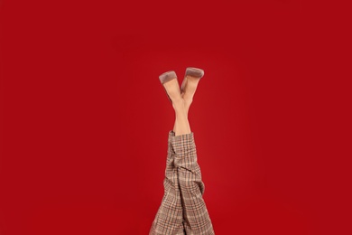 Photo of Woman in elegant shoes on red background