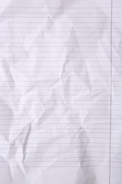 Sheet of crumpled lined paper as background, top view