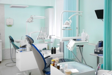 Photo of Dentist's office with modern chairs and professional equipment