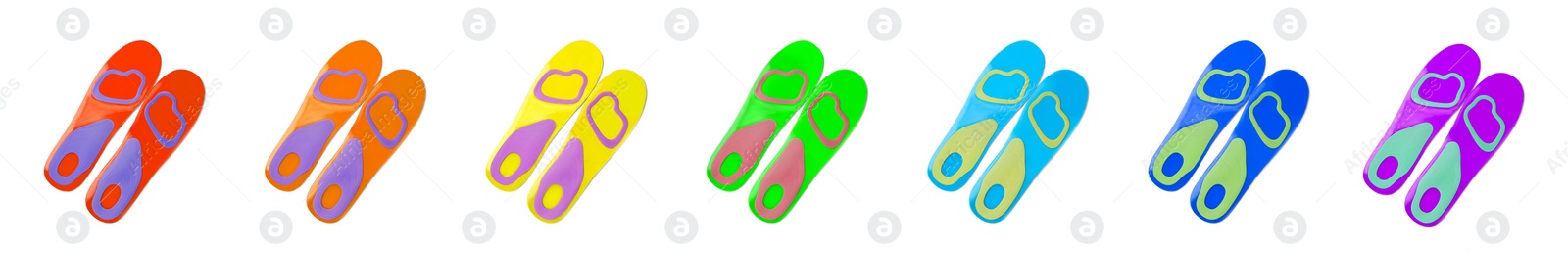 Image of Set with colorful orthopedic insoles on white background, top view. Banner design