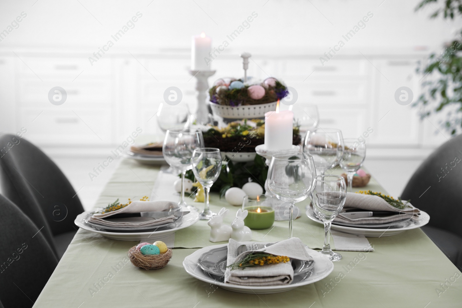 Photo of Beautiful Easter table setting with floral decor indoors