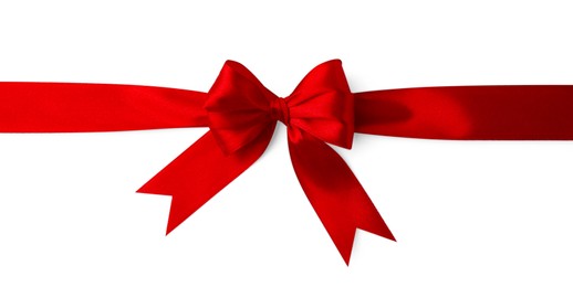 Red satin ribbon with bow isolated on white, top view