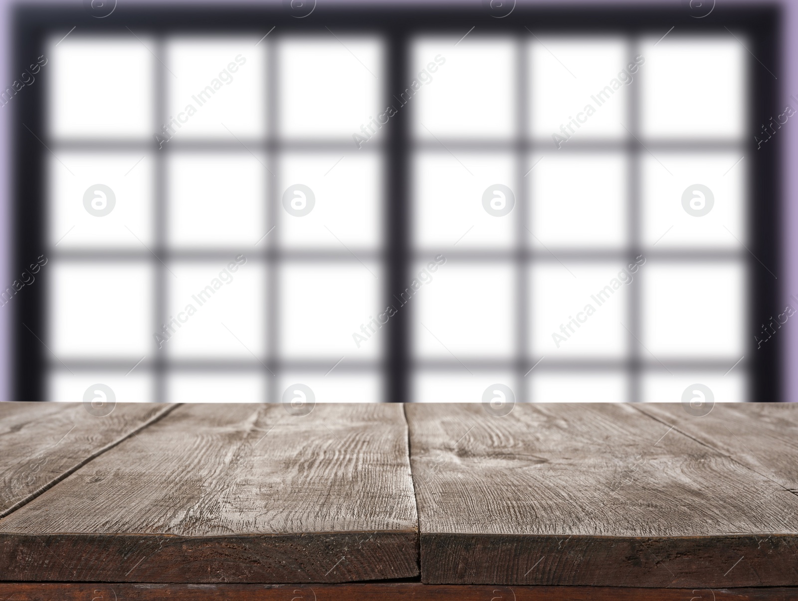 Image of Empty wooden surface and blurred view of modern window 