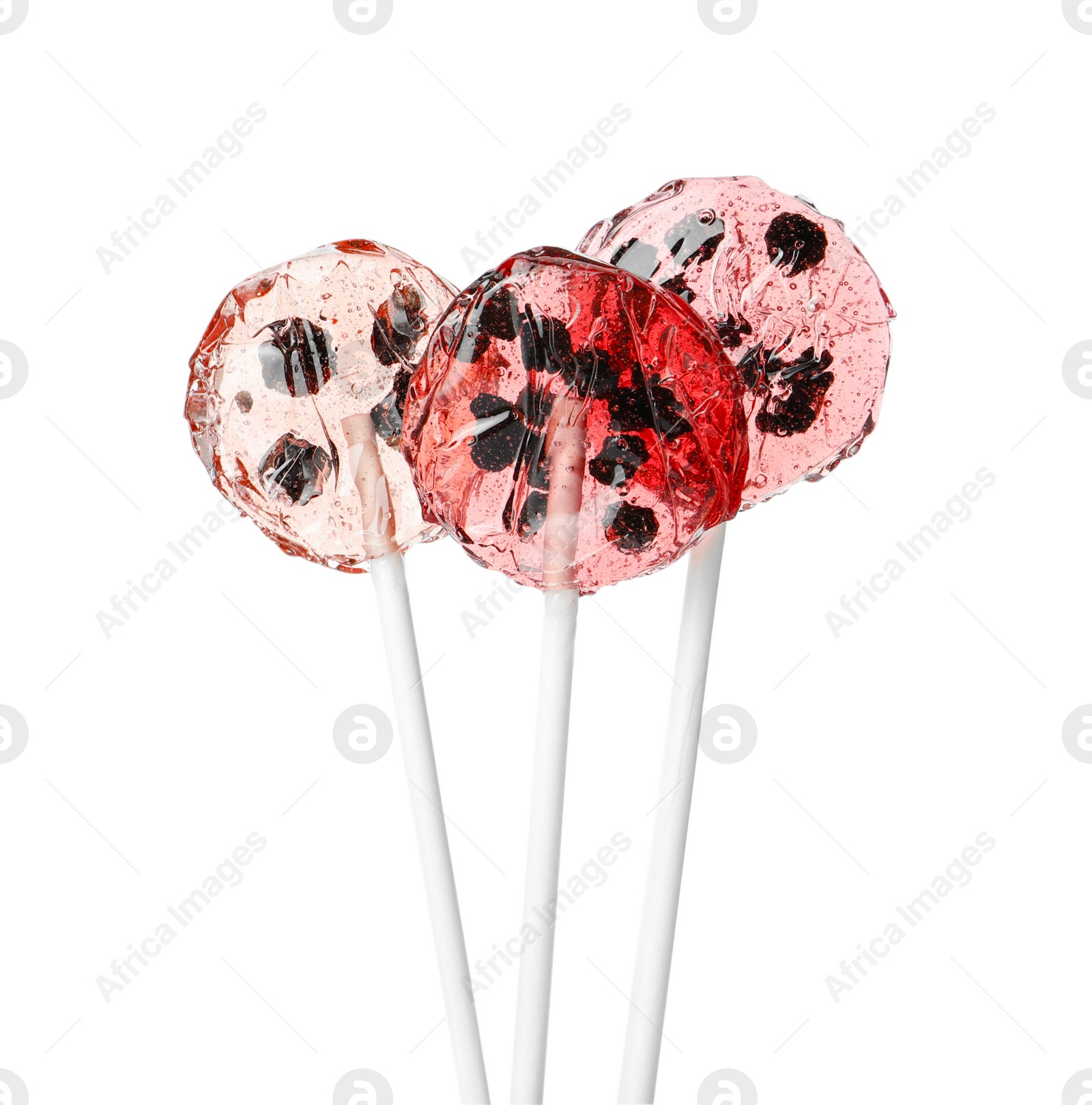 Photo of Sweet colorful lollipops with berries on white background